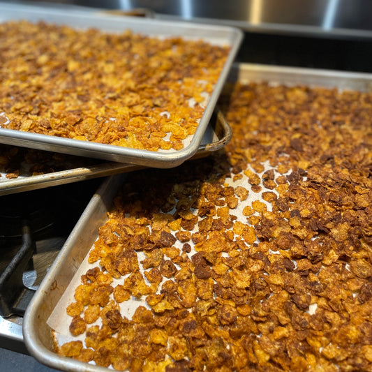 sheet trays filled with caramelized cornflakes