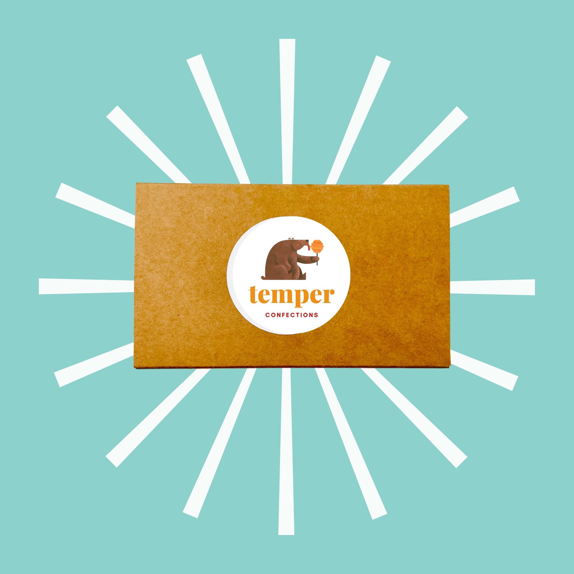 Kraft box with logo sticker on blue background with white designs