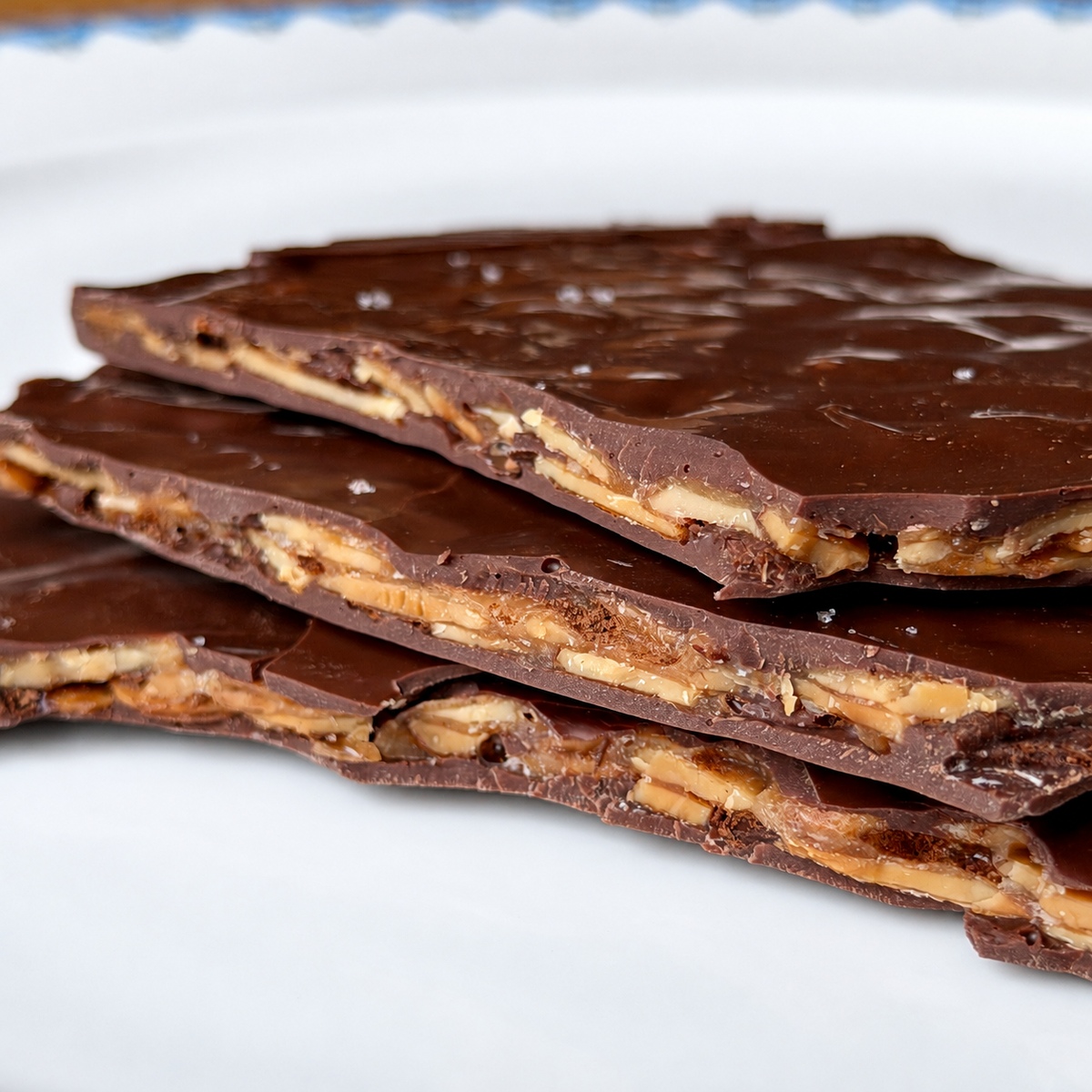Dark milk chocolate almond Florentine with thin caramelized sliced almonds between two layers of chocolate, finished with fleur de sel.