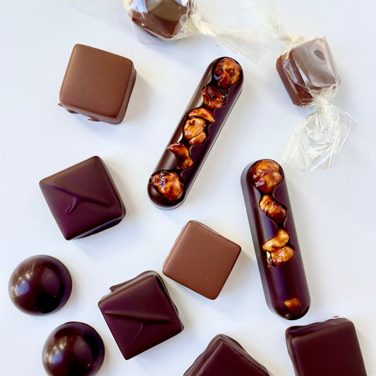 Assorted chocolate candies on a white background