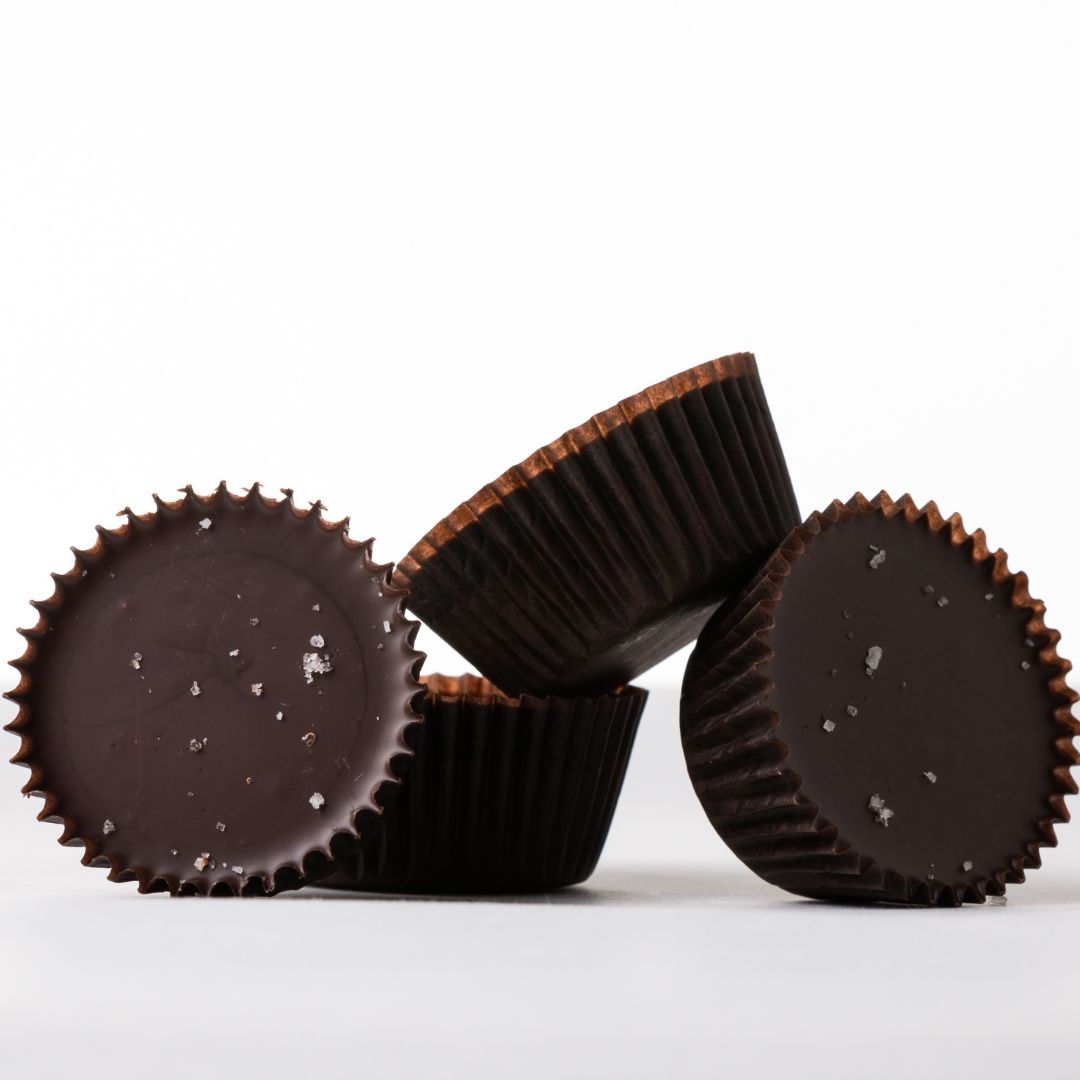 peanut praline cups sitting on white surface