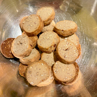 circular shaped cookies in steel bowl