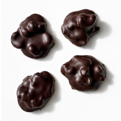 4 pieces of chocolate mounds with nuts on white background