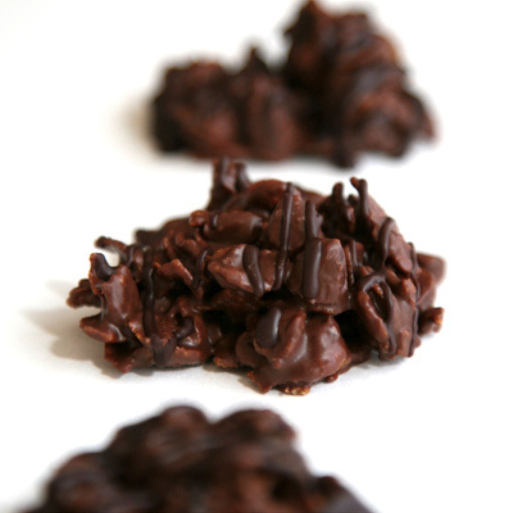 3 rochers sitting in a line on white background