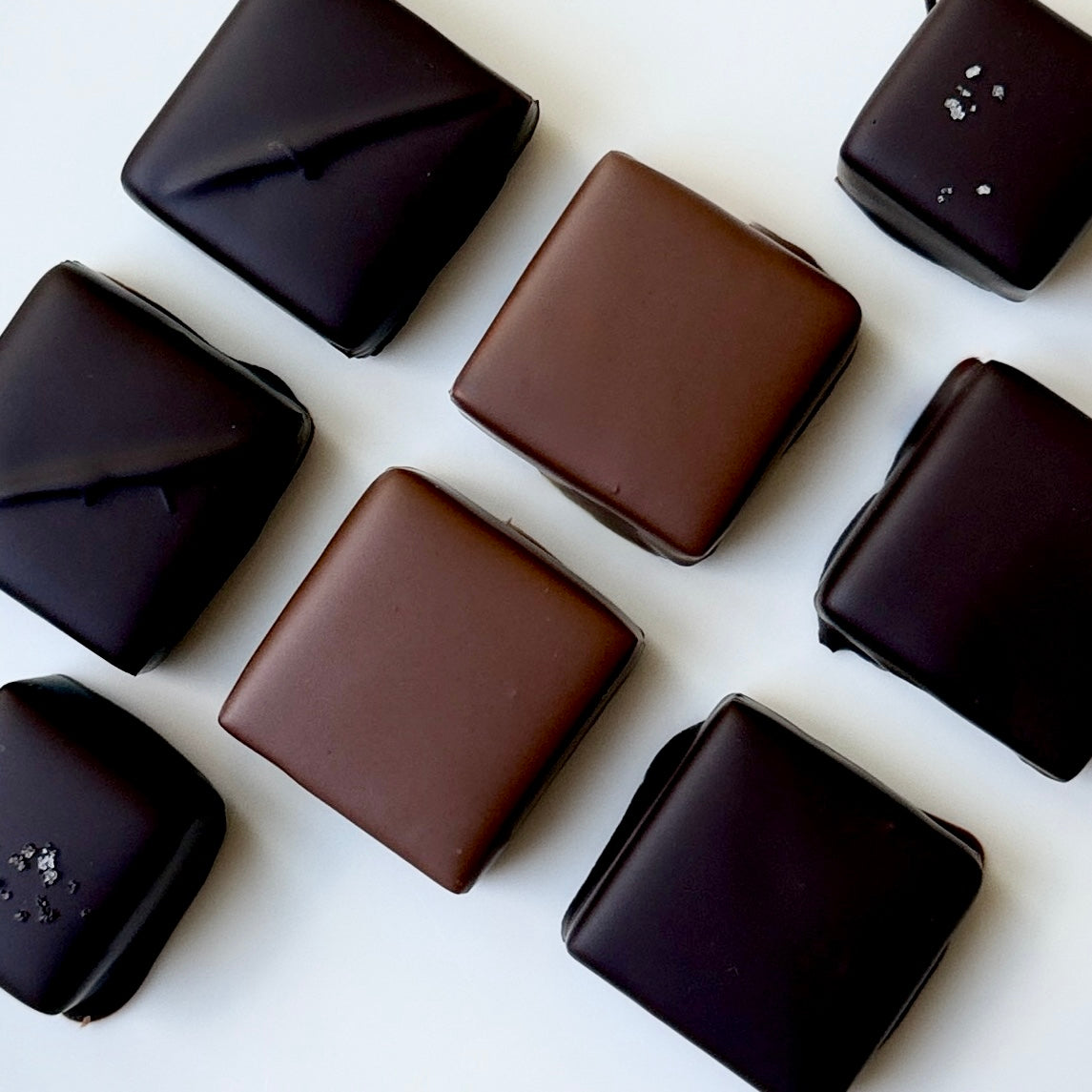 Assorted chocolate candies on a white background