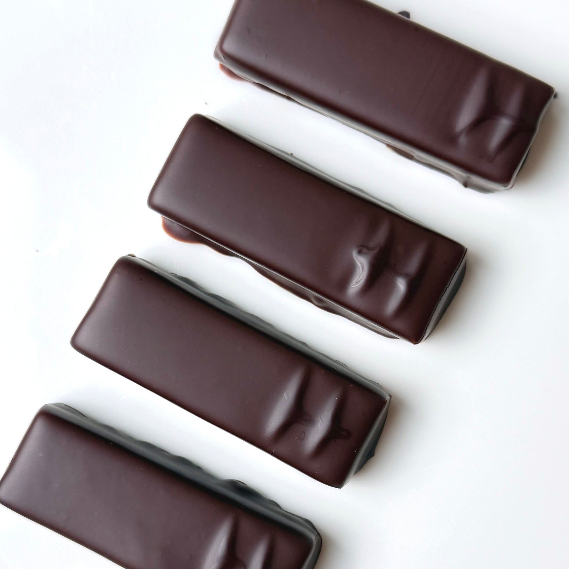 4 chocolate bars on a white background