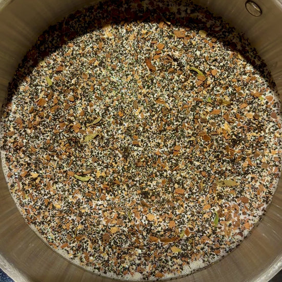 Chai tea infusing in a pot of cream