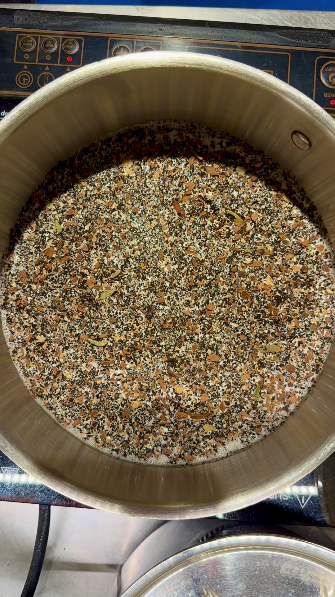 Chai tea infusing in a pot of cream